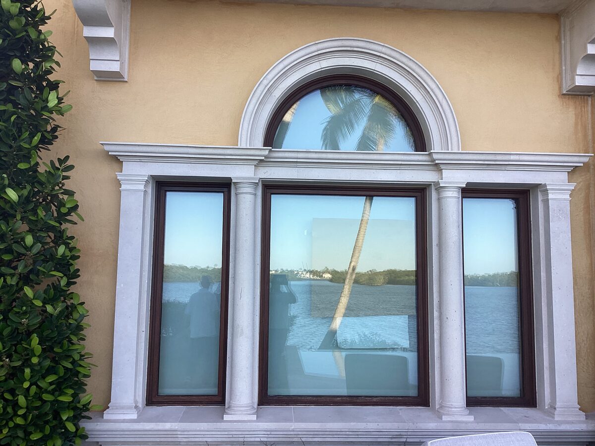 Large arched window with limestone surround
