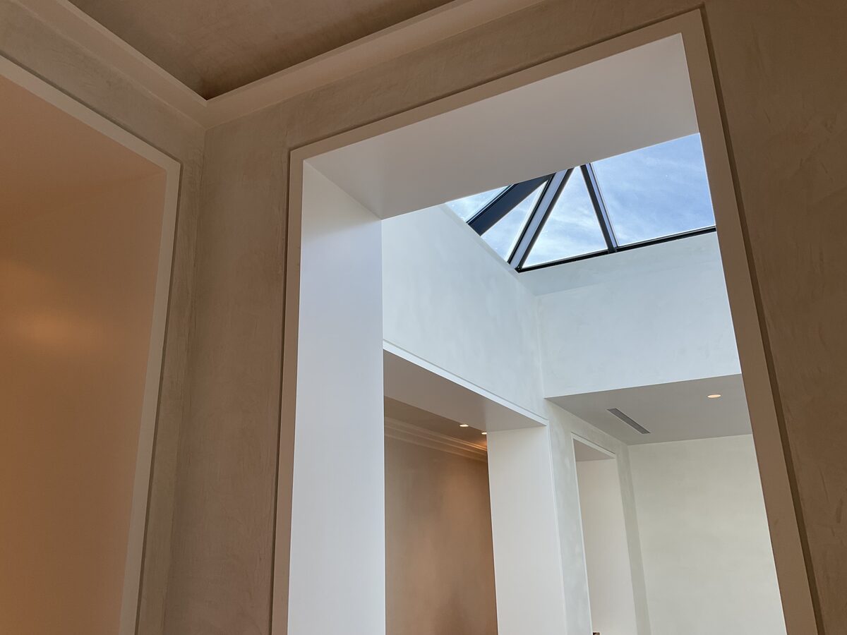 Lime wash entry with skylight detail