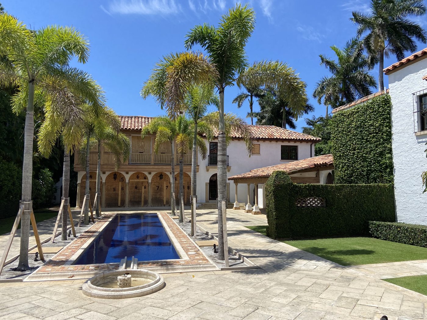 Mediterranean palazzo with reflecting pool, exterior repaint