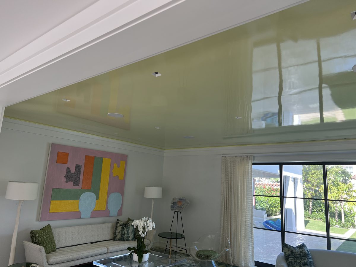 Luxury living room with high-gloss painted ceiling and curated art