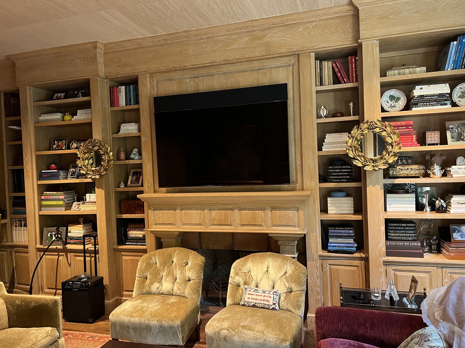 Cerused oak fireplace surround and floor-to-ceiling built-in bookshelves