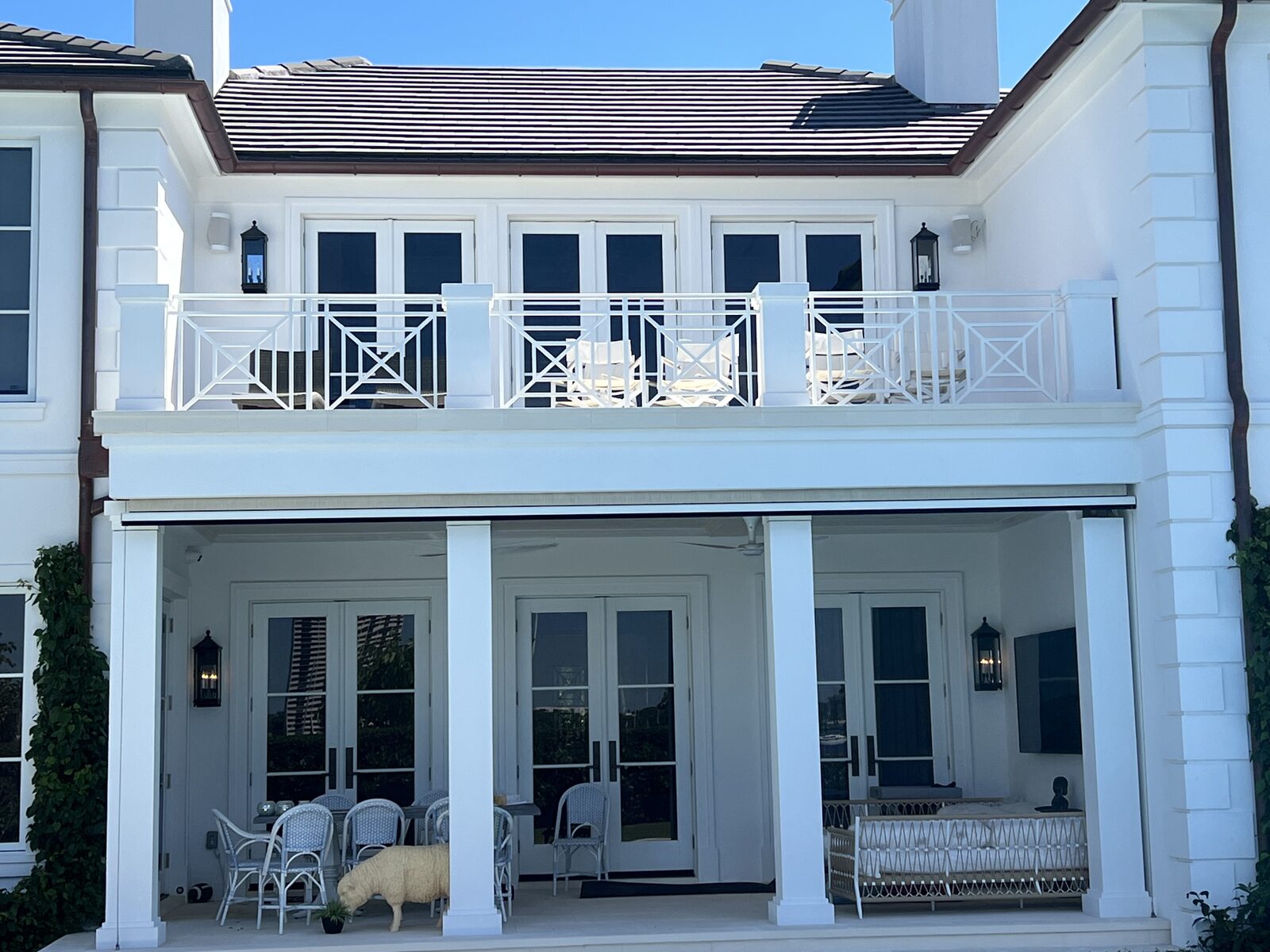 Freshly painted two-story loggia and balcony railing on a coastal estate